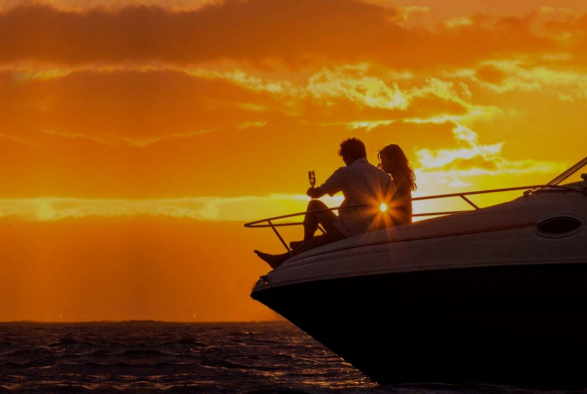 Couple enjoys Sunset on a Private Yacht Sunset Cruise in Santorini