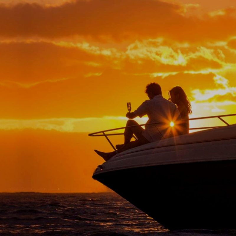 Couple enjoys Sunset on a Private Yacht Sunset Cruise in Santorini